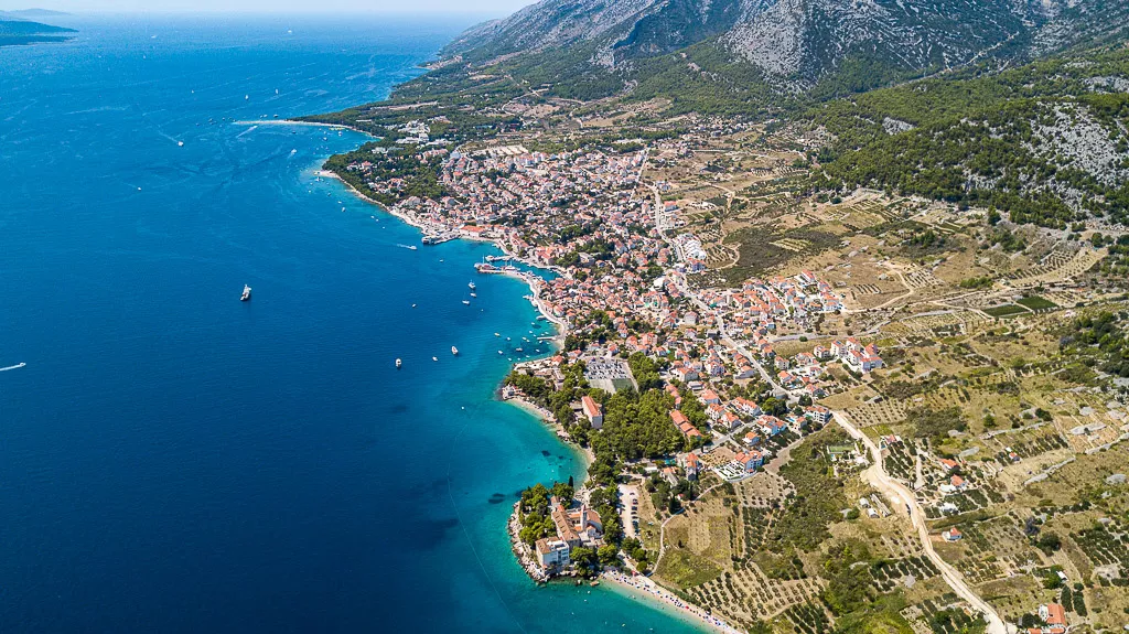 Aerial photo of Bol showing from east (Dominican monastery) to west (Zlatni rat beach) - Croatia