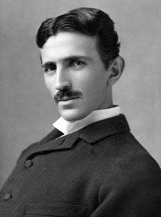 A photograph image of Nikola Tesla (1856-1943) at age 34
