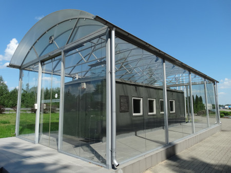 Memorial customs wagon in a transparent enclosure, Medininkai - Lithuania
